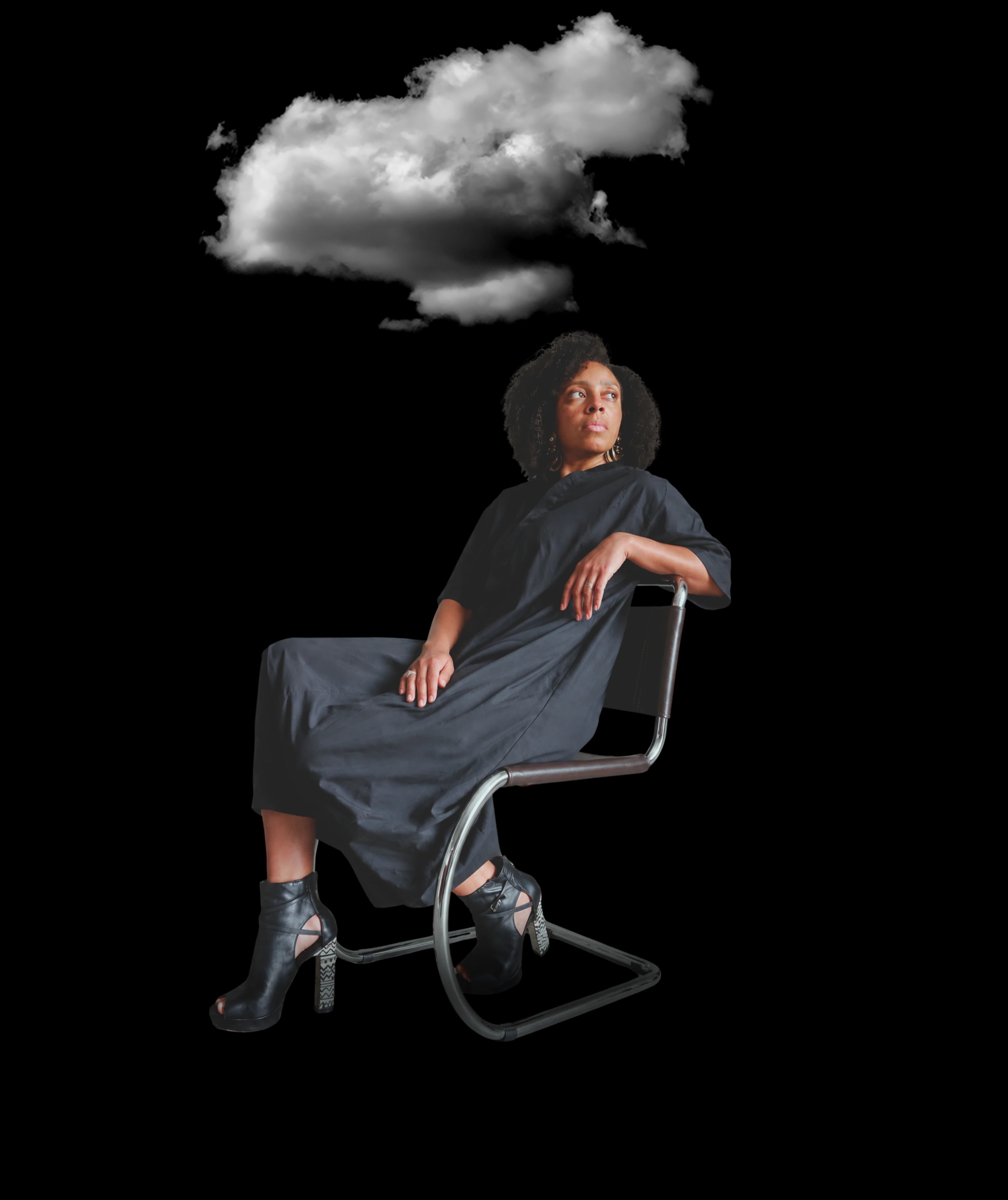 Ashley Williams seated on a cantilever chair