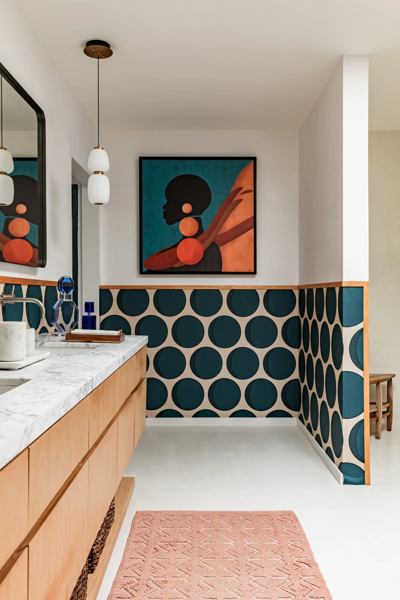 Primary bathroom with a teal circle-tiled vanity wall