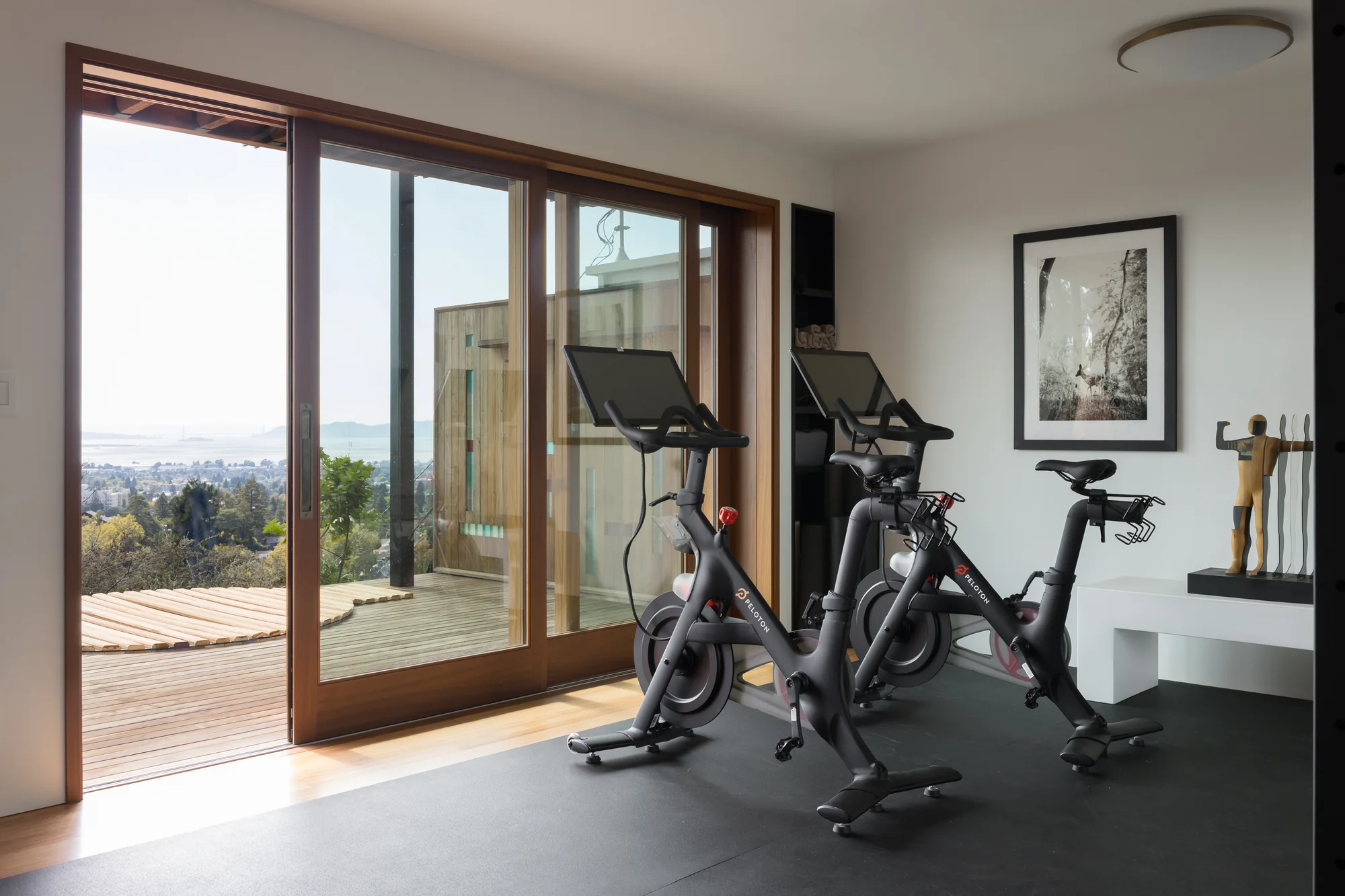 Exercise room opening to the deck through sliding glass