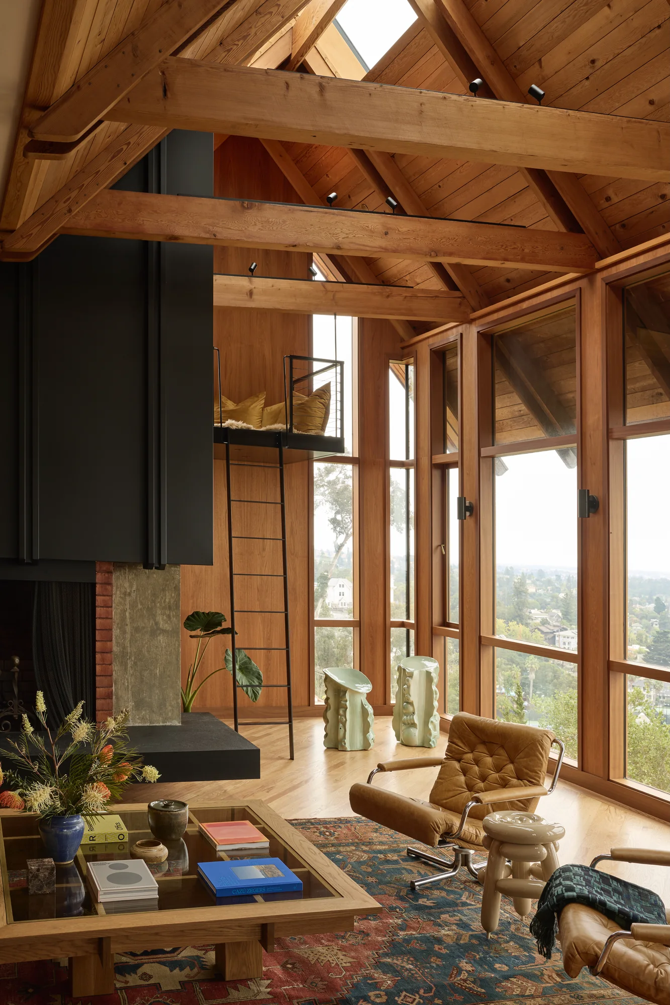 Living room under an exposed timber vault, patterned sofa and low table